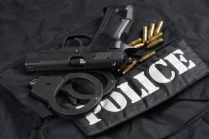 Police belt, gun, handcuffs and ammo